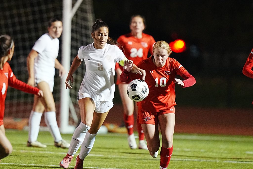 St. Joseph's Julia Nunes (8) and Greenwich's Harriet Franks (10) chase the ball during the FCIAC girls soccer championship game. - Photo courtesy of Paige Shockley