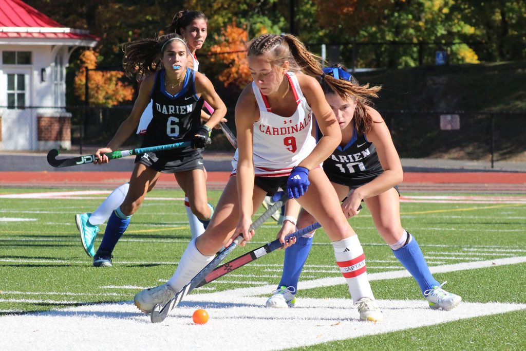Greenwich's Emilia Arroyo (7) plays the ball while Darien's Adriana Gromelski (10) defends. - Photo courtesy of Adrienne Cunningham