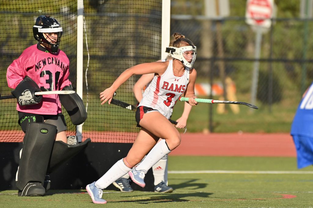 New Canaan's Reagan Celiberti (3) on defense in front of goalie Sarah DeScenza (34). - Photo courtesy of Adrienne Cunningham