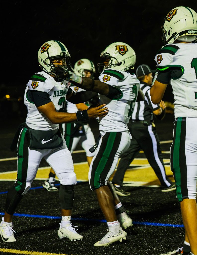 Norwalk's CK Vertus (2) and Easton Pace (3) celebrate a touchdown against Trumbull on Friday, Sept. 25, 2026. - Photo by Luke Sherman/Norwalk Digital Media and Communication Academy